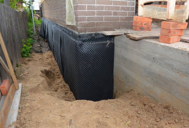 Happy homeowners after waterproofing job in Haydenville